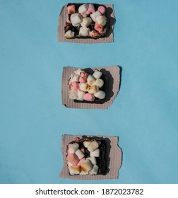 Rocky Road Brownies With Colorful Marshmallows On Blue Background