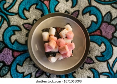 Rocky Road Brownies With Marshmallows On Colorful Fabric Background