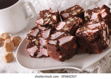 The Rocky Road Dessert Close-up On A Plate And Coffee On The Table. Horizontal
