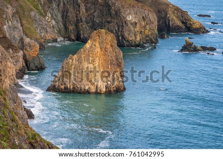 Rocky rugged cliffs on Copper Coast, Waterford, Ireland. Wild Atlantic Way coastal route