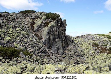 Rocky Scree On The Mountain Peak And Green Color Stones