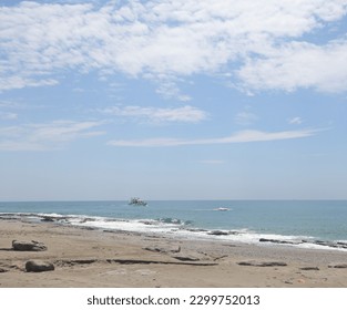 Rocky sea beach on a sunny day in Alanya, Turkiye, May 2023 - Powered by Shutterstock