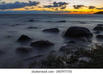 Rocky sea coast at blue hour. Long exposure. Baltic sea. - Powered by Shutterstock