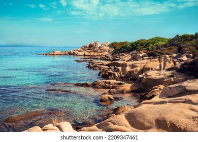 Rocky seascape on a sunny day, view of sunny bay in Aegean sea in Chalkidiki, Vourvourou  beach, Greece