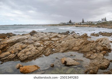 Rocky seashore close-up, cloudy weather, cloudy sky, coastline against cloudy sunset sky, South Australia, Middleton  - Powered by Shutterstock