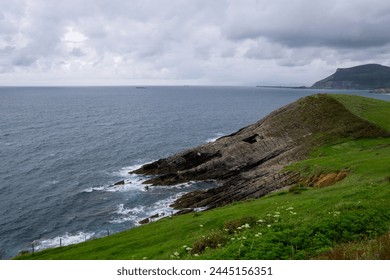 Rocky seashore on a cloudy day. North of Spain, Cantabria. Flysh formation - Powered by Shutterstock