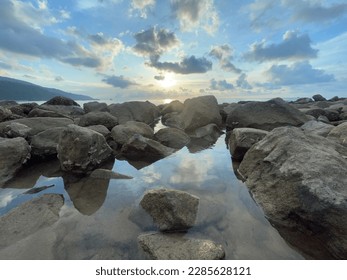 Rocky in shadow with cloud