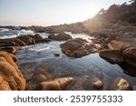 Rocky shore between escalet beach and Cap Taillat, in Ramatuelle, near Saint-Tropez, mediterranean sea, French Riviera, Provence, Europe, France. 