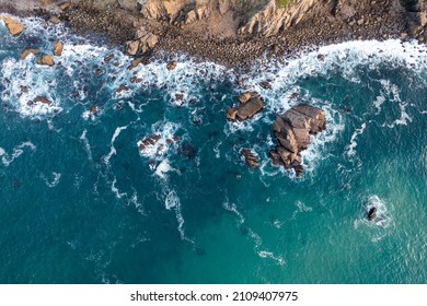 Rocky Shore With Blue Waves. High Quality Photo