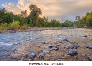 The Rocky Shore Of A Mountain River.