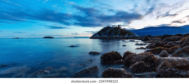 Rocky shore on Pacific Ocean West Coast. Nature Background. Sunset Sky. Whytecliff Park, West Vancouver, BC, Canada. - Shutterstock ID 2347498123