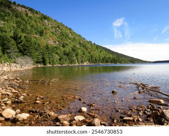 rocky shoreline of mountain lake                             - Powered by Shutterstock