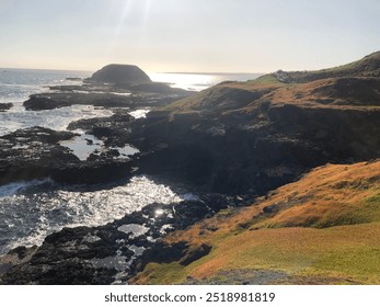 Rocky shoreline sunset on the horizon - Powered by Shutterstock