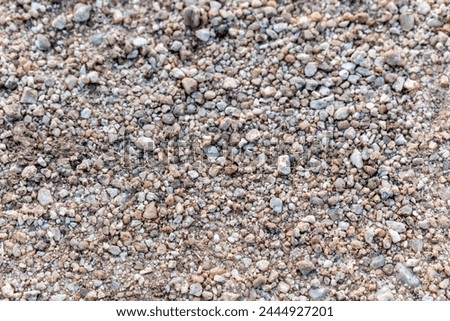 Rocky soil. Top view of rocky stone terrain. Clip. Texture of stone lifeless land high in mountains. Grey area with no vegetation and covered with stones. Sandy and rocky soil texture.