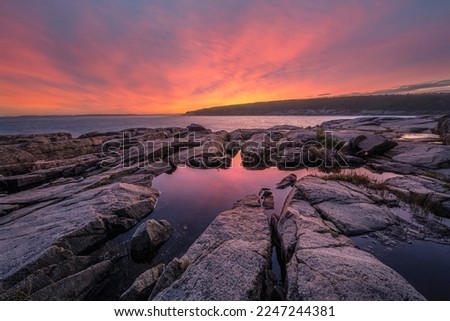 Rocky tide pool sunset along the Ocean Path in Acadia National Park Maine 