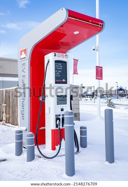 Rocky View County Alberta Canada, April 20\
2022: Petro Canada fast charge EV charging station for Canada\'s\
Electric Highway network after a\
snowfall.