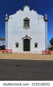 Rococo Ornation On The Doorway And Window-main Facade Of The Hermitage Of Saint Blaise-Ermida De Sao Bras Showing The Stonework Molding Decoration Of Its Frame And Pediment. Tavira-Algarve-Portugal.