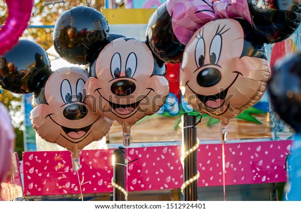 Rodenkirchen, Germany - September 21, 2019: helium balloons with mickey mouse and minnie mouse faces on the fairground "Roonkarker Mart"