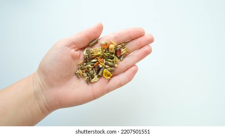 Rodent Food From Cereals And Seeds In Hand On A White Background