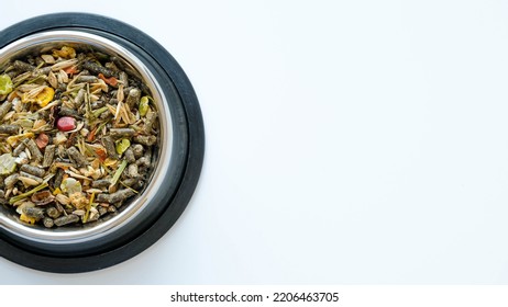 Rodent Food From Cereals And Seeds In A Metal Round Bowl On A White Background With A Copy Space