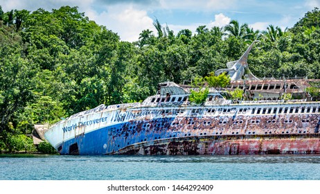 Roderick Bay, Solomon Islands -December 12, 2017, Wreck Of MS World Discoverer Cruise Ship, Wrecked April 30, 2000 After Striking An Uncharted Reef. Rusty Ships Hull Grown With Trop