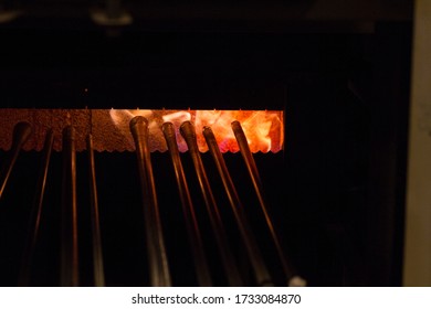 Rods Warming In An Oven At A Glass Blowing Class