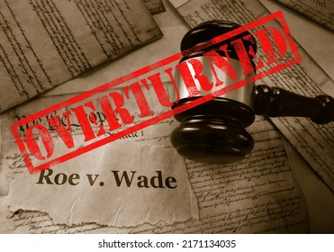  Roe v Wade news headline with gavel and Overturned stamp on a copy of the United States Constitution                              