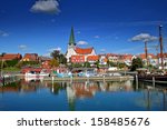 Roenne harbor and church seen from the sea, Bornholm, Denmark