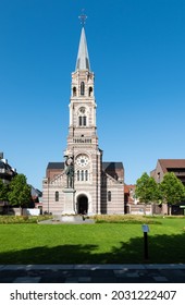 Roeselare, East Flemish Region - Belgium - 07 19 2021 Tower And Square Of The Saint Nichaols Church With A Blue Sky Background