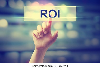 ROI Concept With Hand Pressing A Button On Blurred Abstract Background