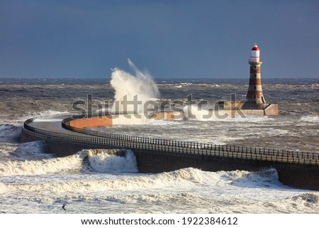Roker Pier During a Storm with rough Sea. Sunderland, England, UK.