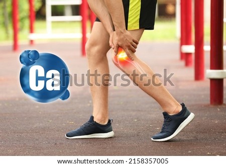 Role of calcium for human. Man suffering from pain in knee at stadium