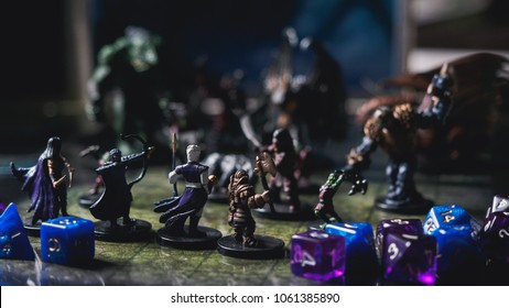 Role play board game with miniatures with dragon in dungeons.
