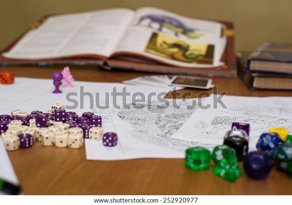 role playing game set up on table on beige\
background - stock photo