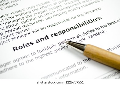 Roles and responsibilities with wooden pen - Shutterstock ID 1226759551