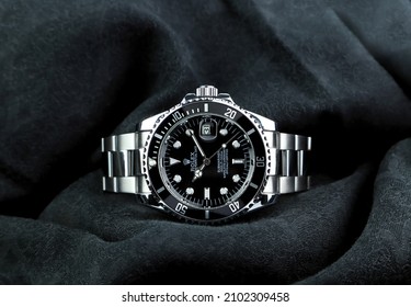 The Rolex Vintage Wristwatch Ceramic Bezel Model Black Oyster Perpetual Submariner Date 39 Mm Display On Black Table With Black Cloth In The Luxury Watch Shop