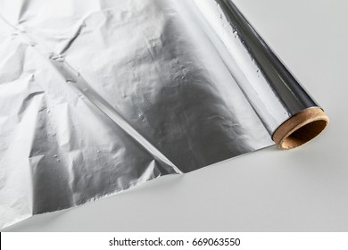 Roll Of Aluminum Foil Isolated On White Background