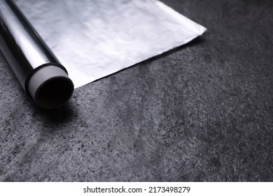 Roll Of Aluminum Foil On Grey Table, Closeup. Space For Text