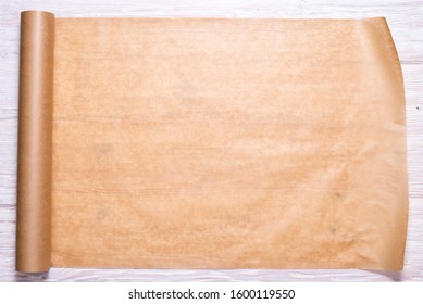 Roll Of Baking Paper On Wooden Background