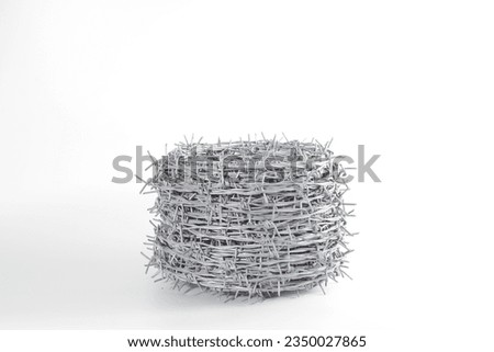 A roll of barbed wire over white background
