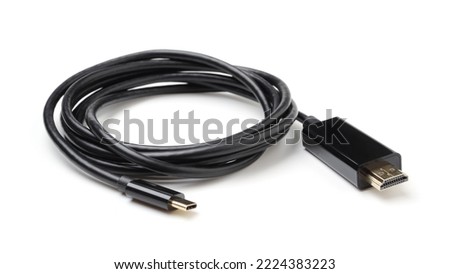 Roll of black electric cable isolated on white. USB Type-C, HDMI.