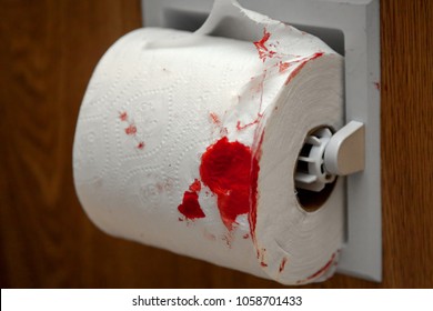 toilet paper covered in blood