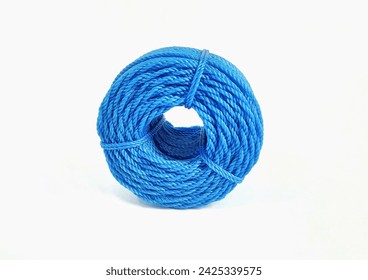 Roll of blue nylon rope isolated on white background with copy space. Clipping path. 
