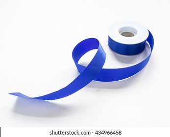 Roll Of Blue Ribbon On White Background