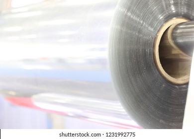 A Roll Of Clear Plastic Sheet For Manufacturing Process ; Industrial Background