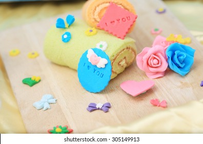 roll with cute sugar paste on wood board