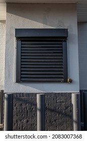 A Roll Down Steel Security Door To Protect A Drive Thru Window