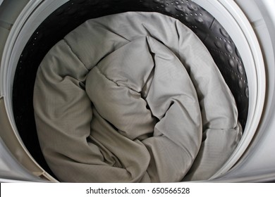 Roll Up The Duvet Put In A Washing Machine.