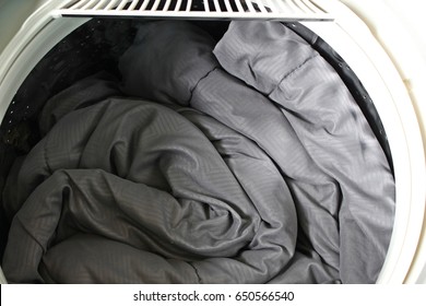 Roll Up The Duvet Put In A Washing Machine.