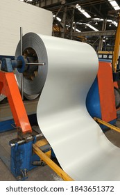 Roll Of Galvanized Steel Sheet At Cutting Machine, Ironworks And Metalwork Manufacturing Factory For Production Of Metal Pipes And Tubes